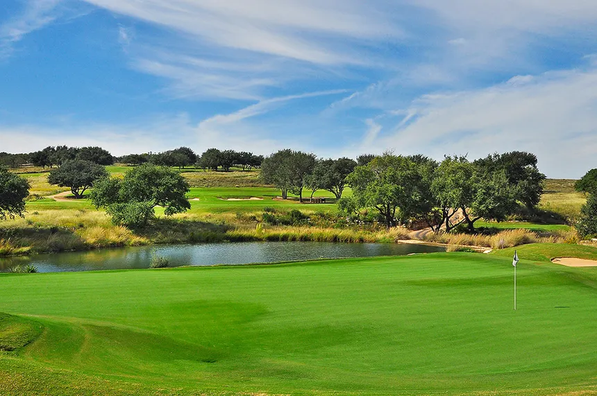 Spanish Oaks golf course fairway framed by Hill Country ridges near Bee Cave, Texas